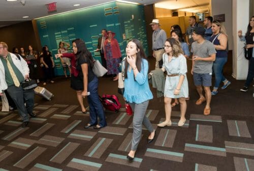 Students are walking in the hall of HEC building