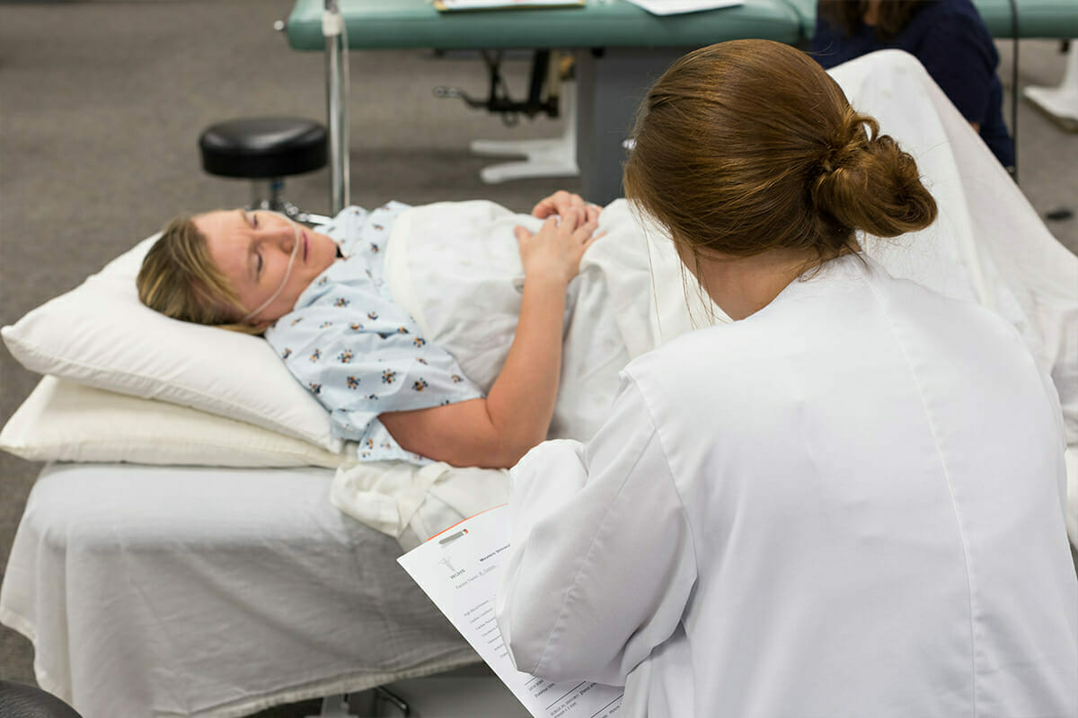 Student working with patient